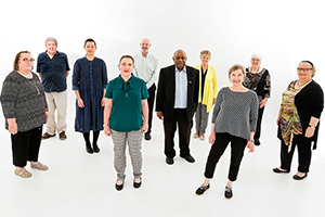 Ten members of the Fiona Stanley Hospital Consumer Advisory Council standing together.